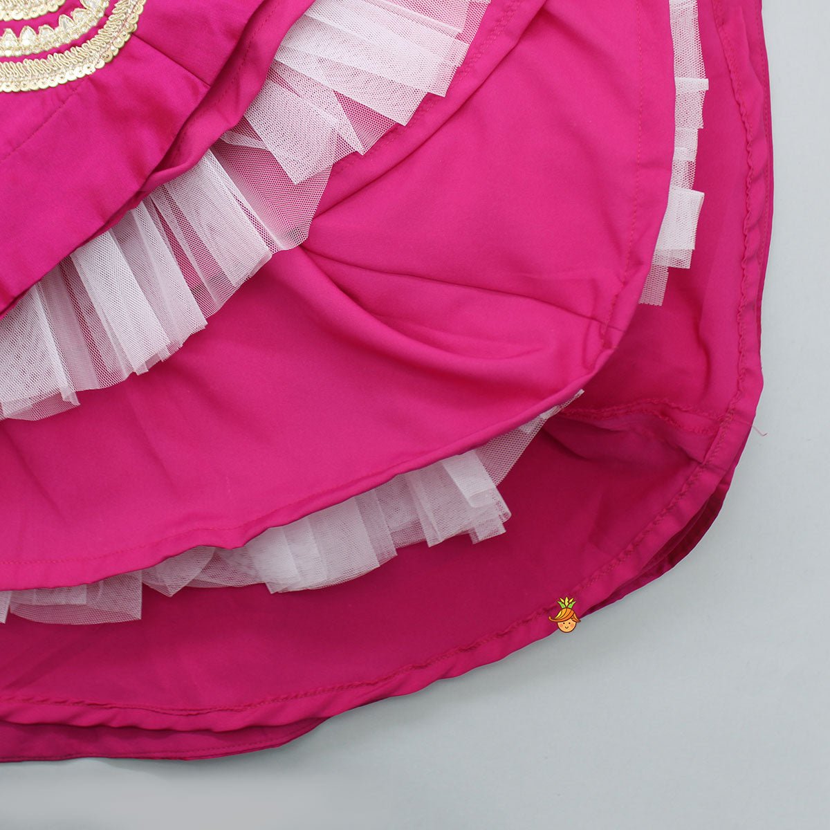 Gota Work Hot Pink Top  And Elegant Tassels Embellished Flared Lehenga With Net Dupatta