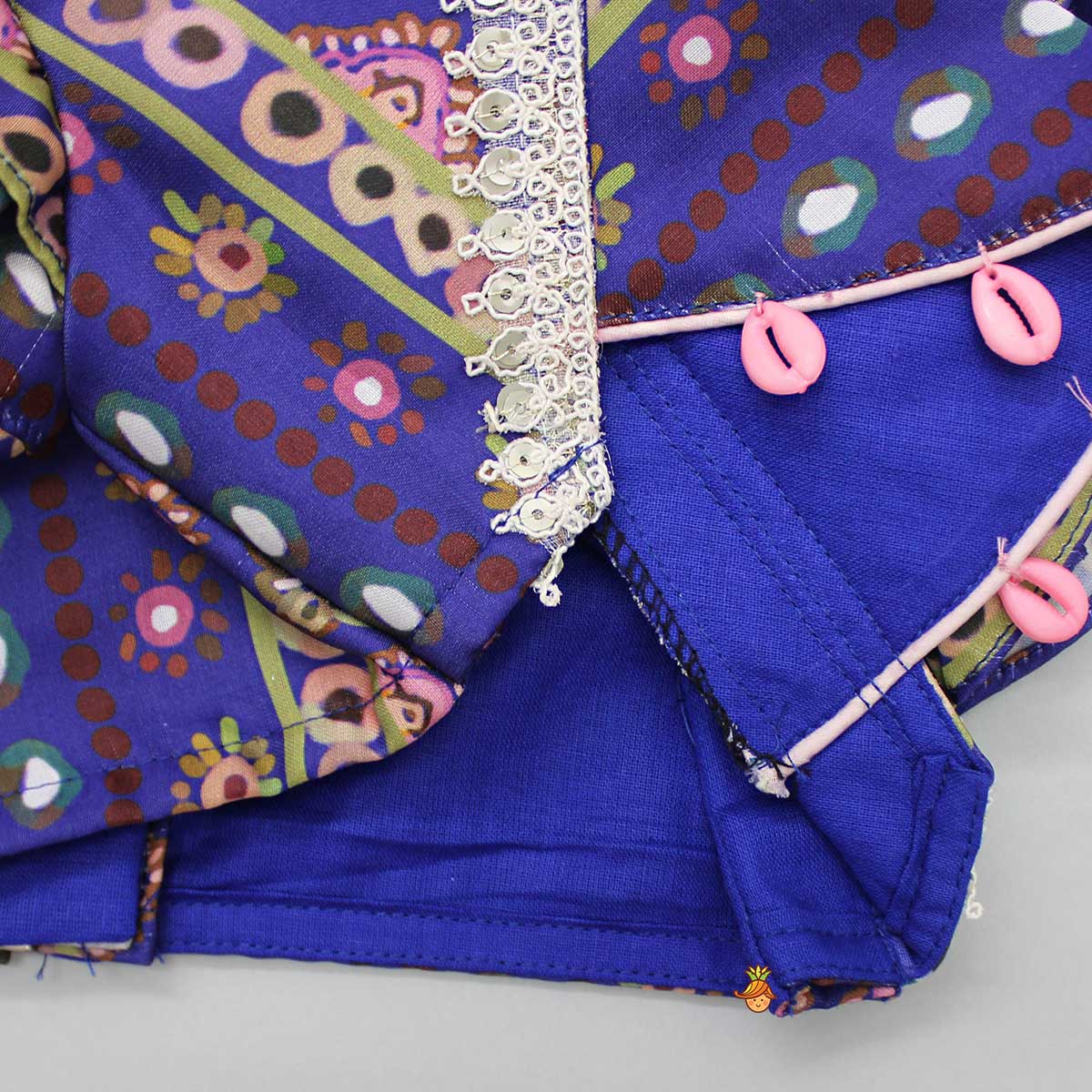 Layered Sleeves Blue Top And Fabric Flower Tassels Enhanced Lehenga With Purple Net Dupatta