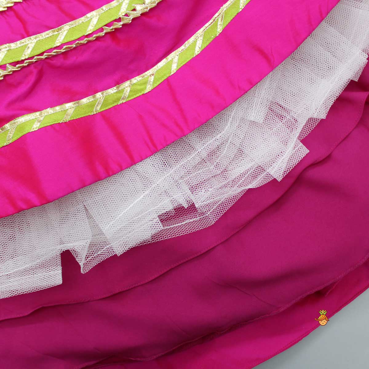Stylish Cut Out Hem Pink Sleeveless Top And Lehenga With Contrasting Net Dupatta