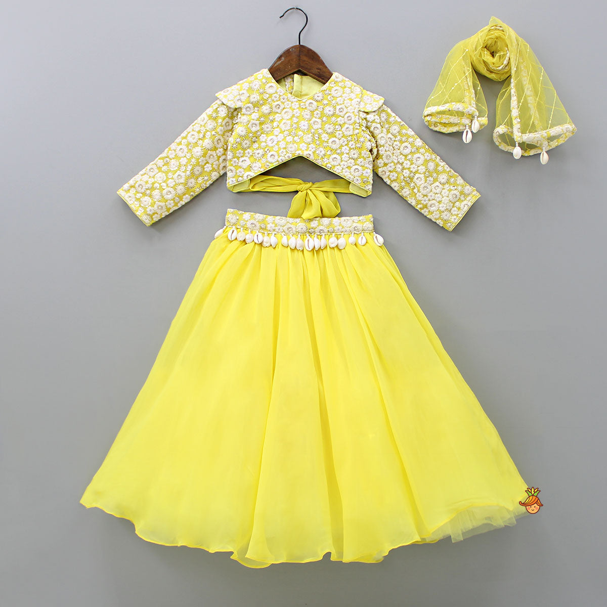 Stylish Cut Out Back Yellow Top And Lehenga With Net Dupatta